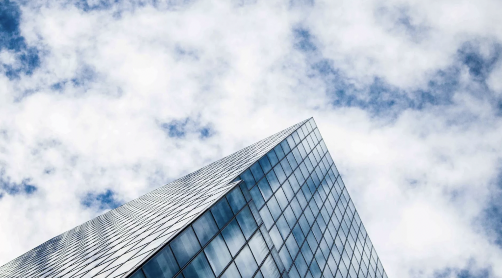 Image of an office building with clouds